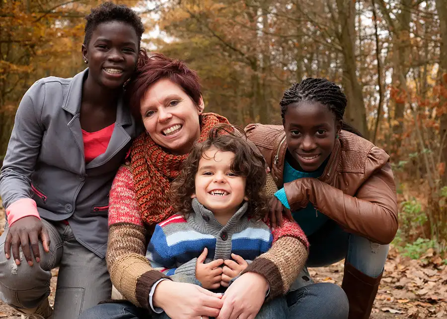 Foster parent concept - young woman posing with her three foster children - Decatur, IL