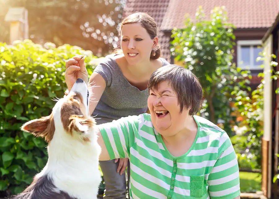 Guardianship - young woman is the legal guardian of disabled adult friend/relative - woman training dog together, service dog - Springfield, IL